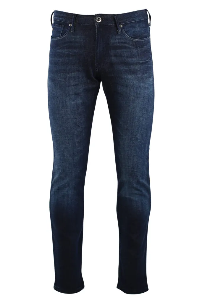 Pantalón vaquero azul oscuro con logo águila en metal plateado